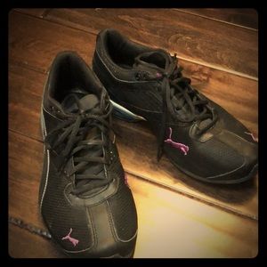 Black Puma sneakers with purple puma emblem